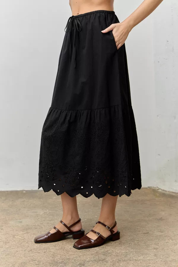 The Cora Scallop Embroidered Eyelet Maxi Skirt in Black