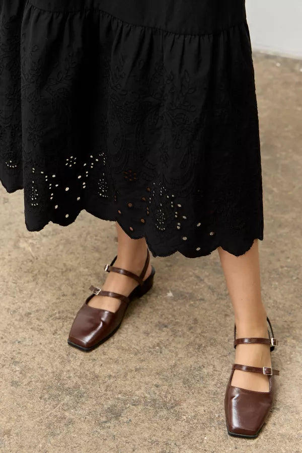 The Cora Scallop Embroidered Eyelet Maxi Skirt in Black