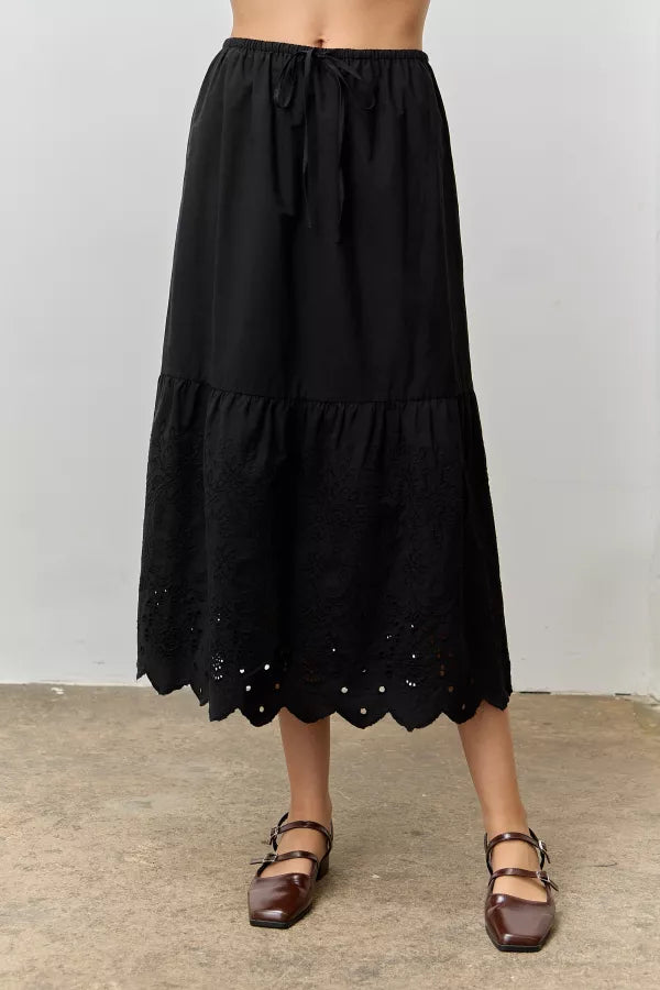 The Cora Scallop Embroidered Eyelet Maxi Skirt in Black