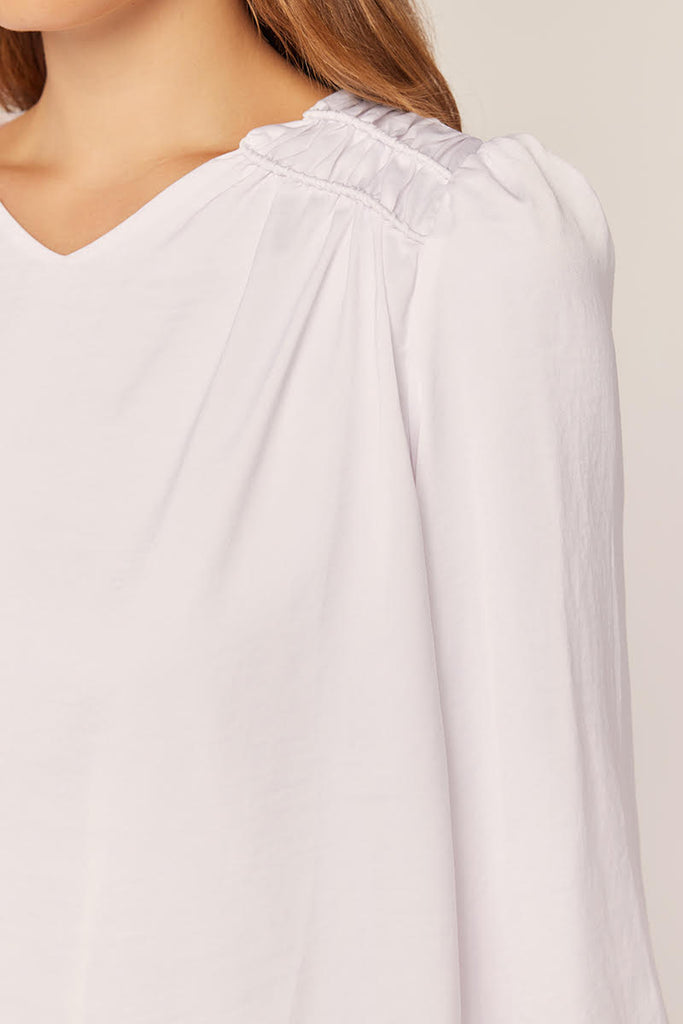 The Carli White Detailed Shoulder w/Ruffle Top Temple