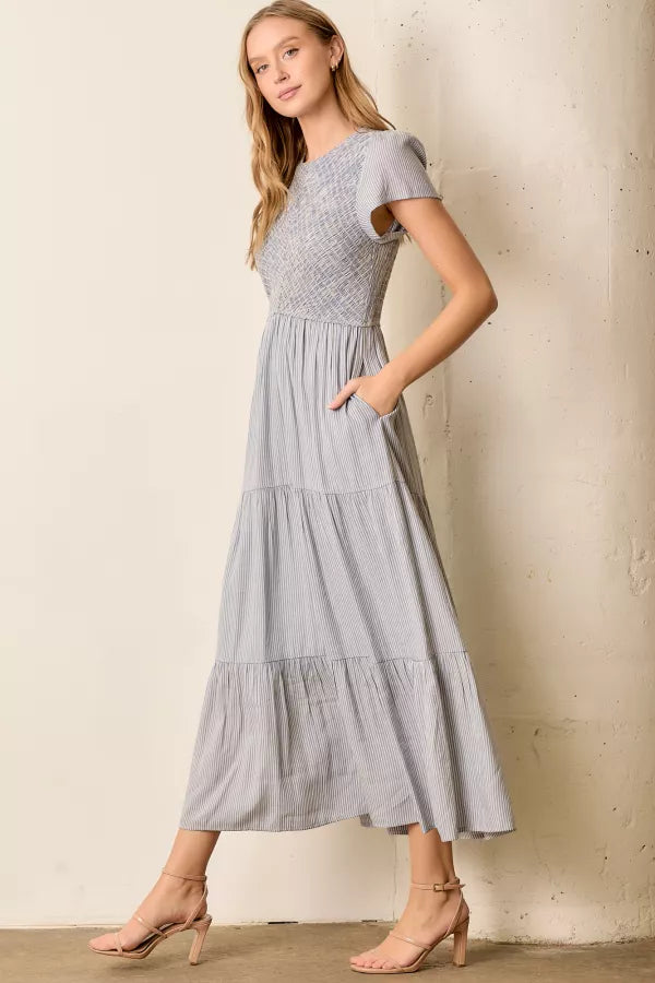 The Malia Smocked Tiered Maxi Dress in Blue