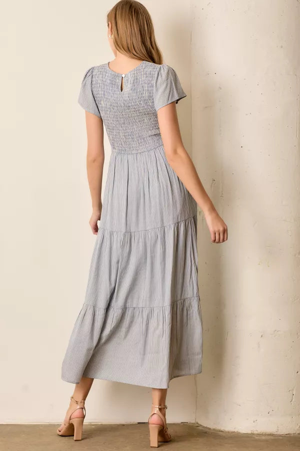 The Malia Smocked Tiered Maxi Dress in Blue