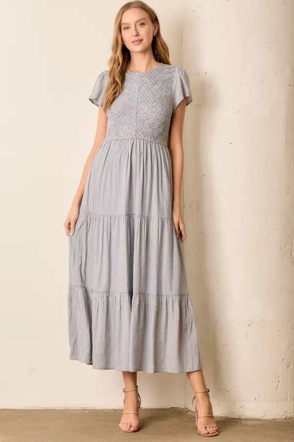 The Malia Smocked Tiered Maxi Dress in Blue